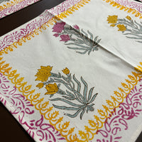 Decorative tablecloth with floral patterns and colorful borders on a wooden surface. Affordable home decor ideas for dinging table. Pinterest homes . Pinterest dining table decor ideas