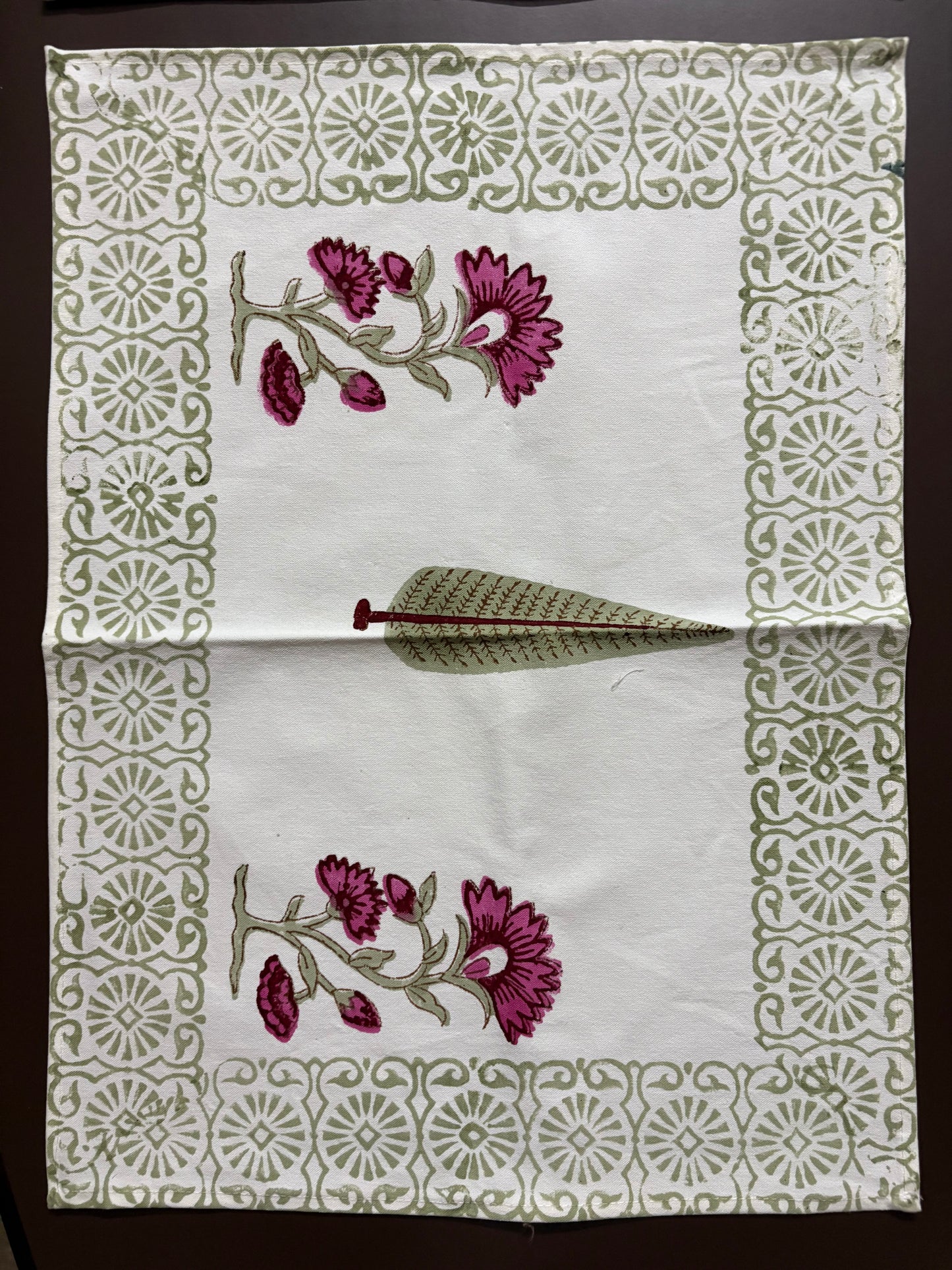 Indian beautiful block printed fabric with floral design and decorative border on a white background
