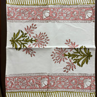 Decorative fabric with floral and leaf patterns on a white background