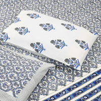 Textile with blue and white floral patterns on a gray background